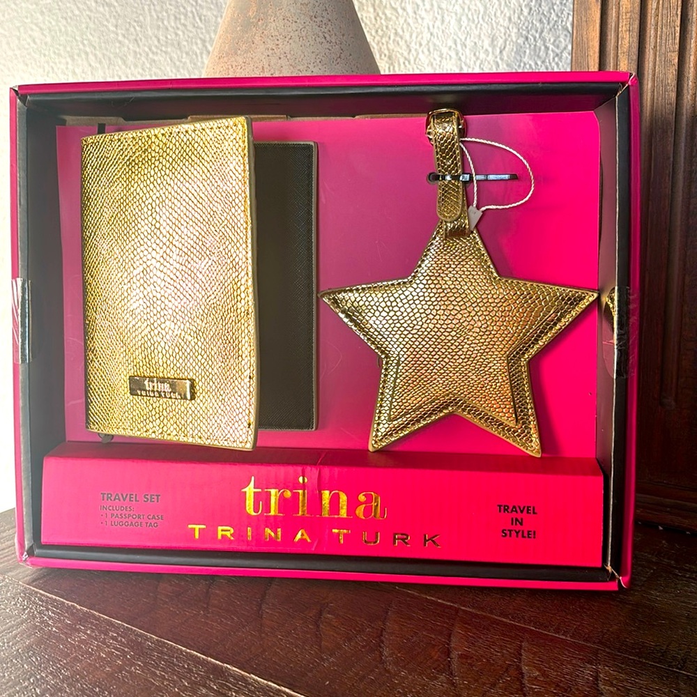 Trina Turk passport holder and luggage tag set. Gold, new in a box.